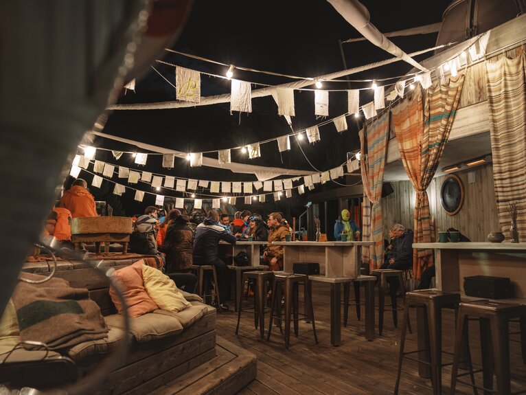Illuminated terrace with flags- Hotel Cervo | © Gabriel_Perren